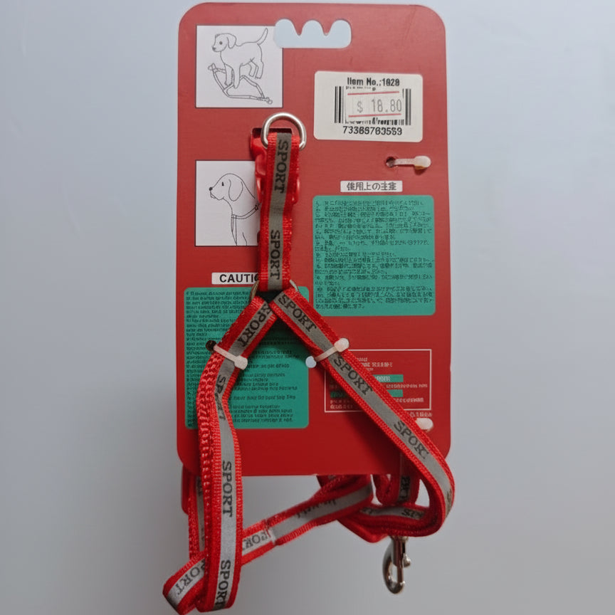 Red dog leash with packaging held by a hand against a light gray background